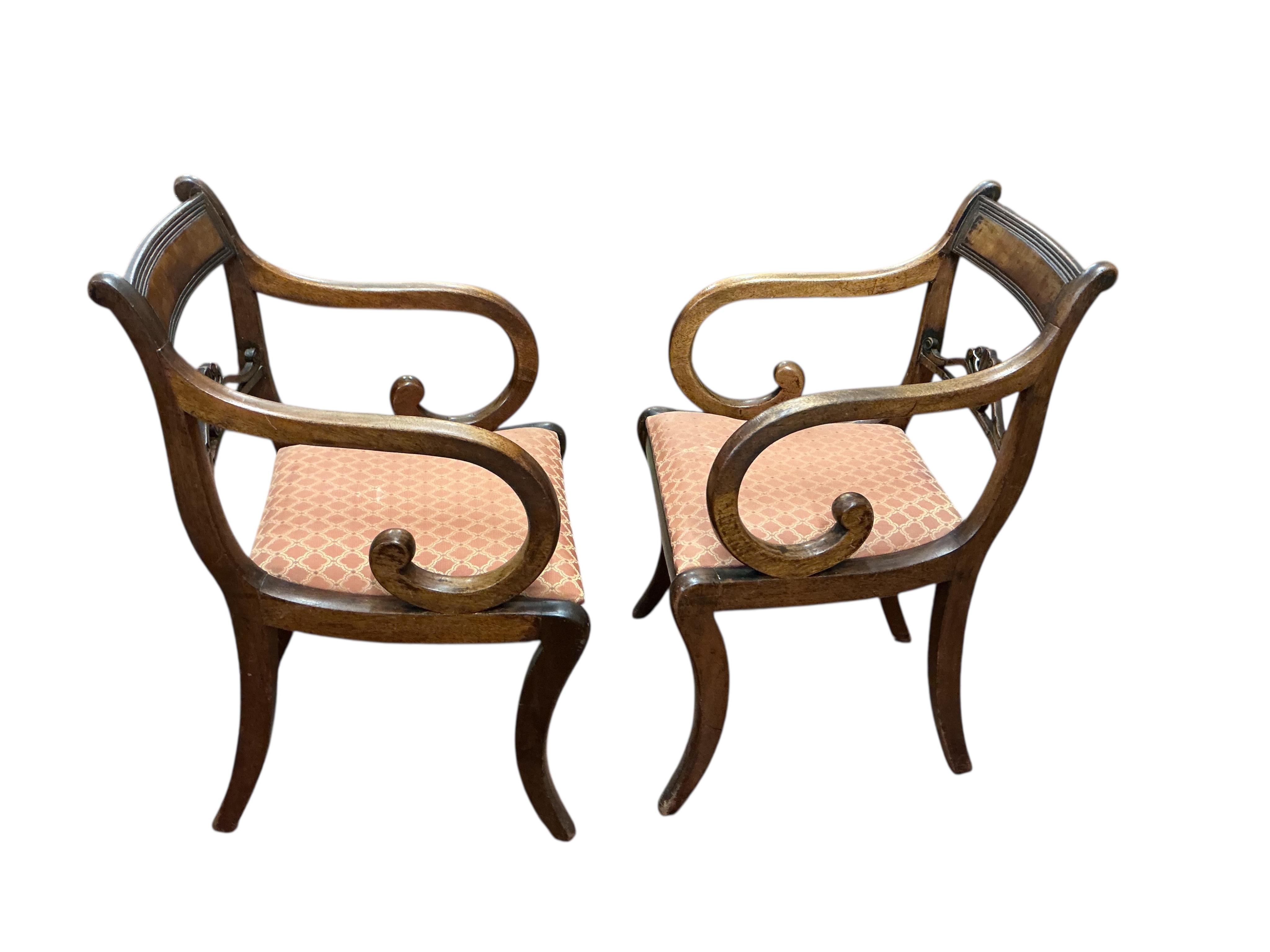 A set of eight Regency mahogany dining chairs, two with arms.